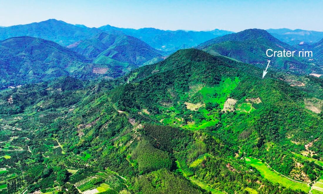 ExplorersWeb's tweet card. Researchers have discovered an impact crater 900m in diameter in southern China. It hit less than 10,000 years ago, when people were living in the region.