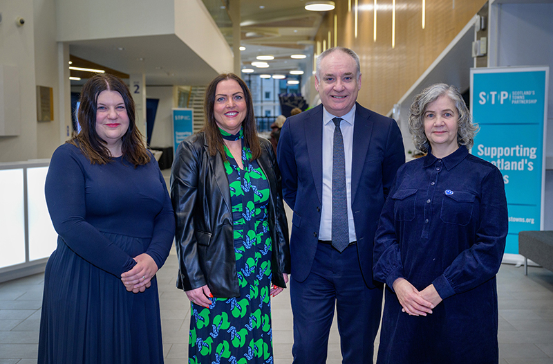 projectscot's tweet card. Glasgow City Council leader Susan Aitken and business minister Richard Lochhead with Scotland’s Towns Partnership chief officer Kimberley Guthrie and vice-c ...