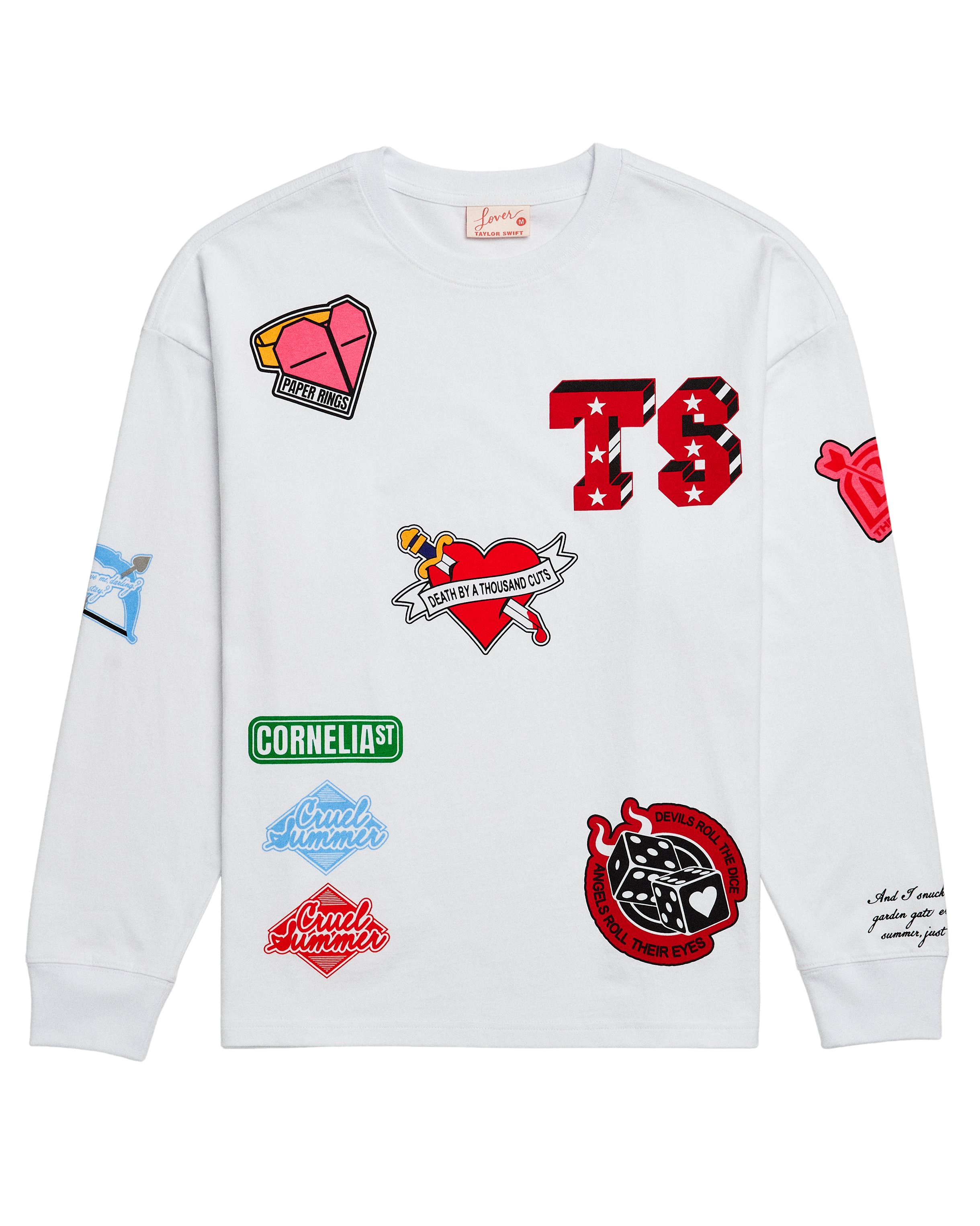 AlertsForMerch's tweet card. White long sleeve t-shirt featuring "Paper Rings" song lyrics, "TS" logo, "Death By A Thousand Cuts" song lyrics, "Cornelia St" song lyrics, "Cruel Summer" song lyrics, "Devils roll the dice angels...