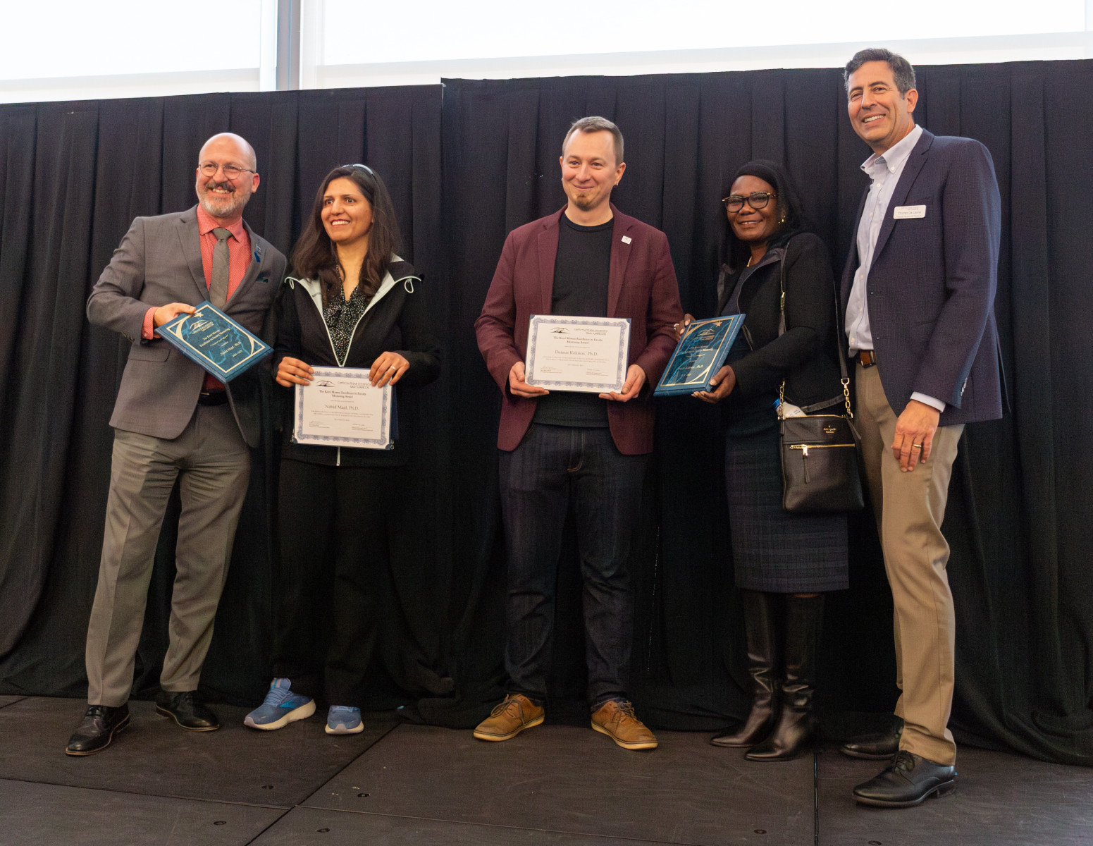 CSUSM's tweet card. Biology professor Dennis Kolosov and computer science professor Nahid Majd received the 2024-2025 Kerri Mowen Award, honoring their dedication to advancing undergraduate involvement in research and...
