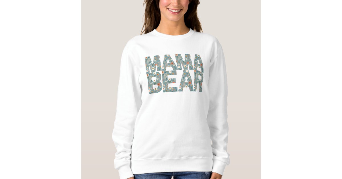 ShellsDesigns2's tweet card. The Mama' trend in sweatshirts and t-shirts has become quite popular. Here is a fun blue background with ditsy print flowers in the 'Mama Bear' font expressing a mama's love for her family and...