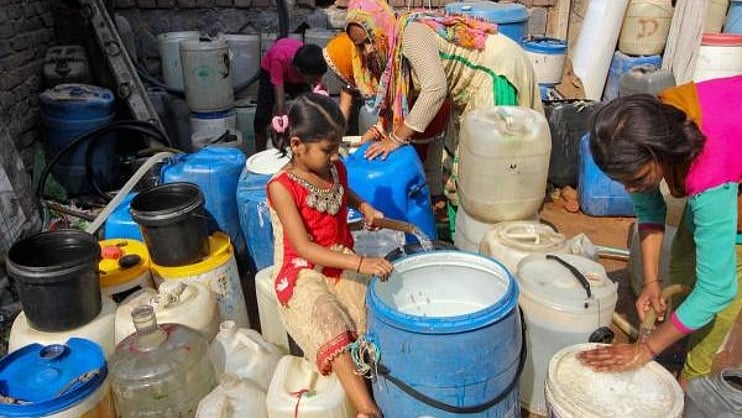 DeccanHerald's tweet card. Urban Development Delhi: Centre sanctions ₹800 crore under AMRUT for Delhi Jal Board to provide sewer links in slums, aiding Yamuna rejuvenation.