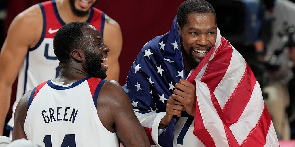 FoxNews's tweet card. United States men’s basketball players Kevin Durant and Draymond Green were seen celebrating during the team’s bus ride to the airport after the U.S. defeated France and won gold at the Tokyo...