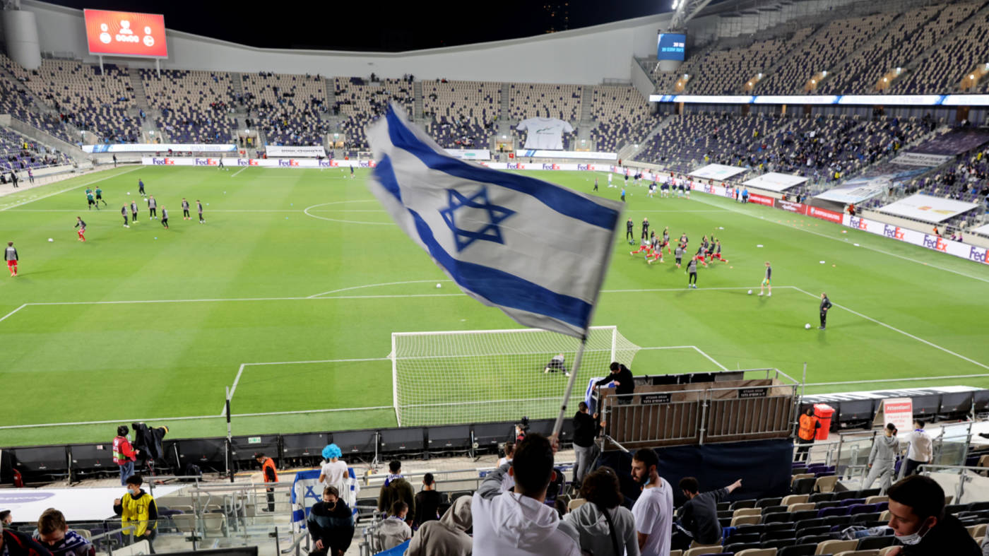 MiddleEastEye's tweet card. Calls increase for the state's teams to be banned amid genocide in Gaza and ahead of FIFA World Cup in North America