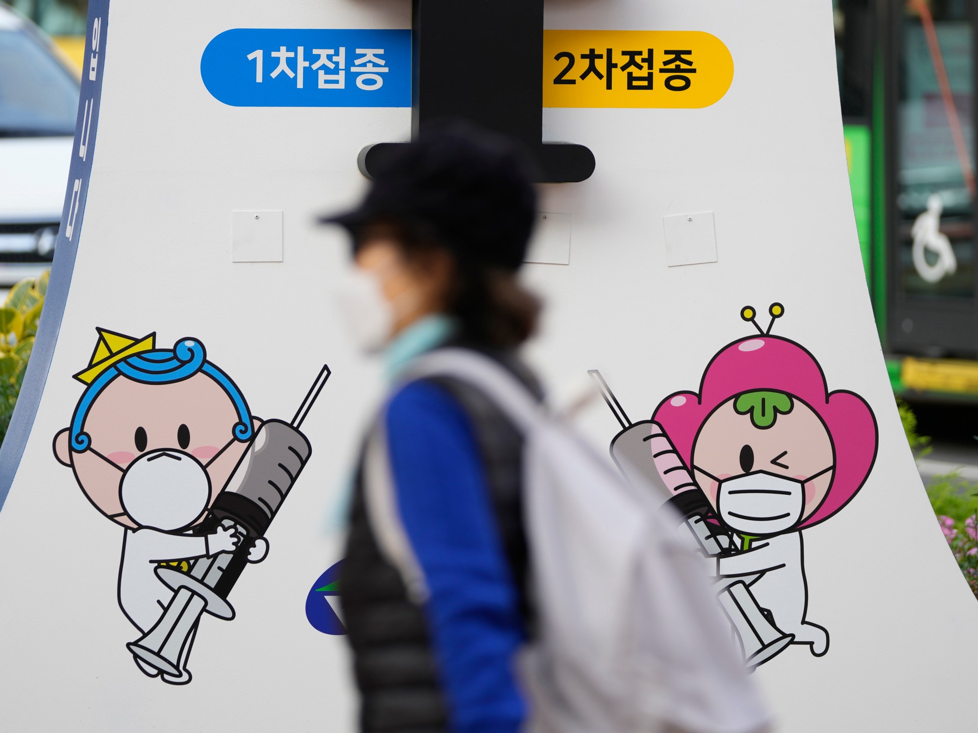 AJEnglish's tweet card. Questions raised over requirements for foreigners jabbed overseas but residents in South Korea to 'prove' their status.