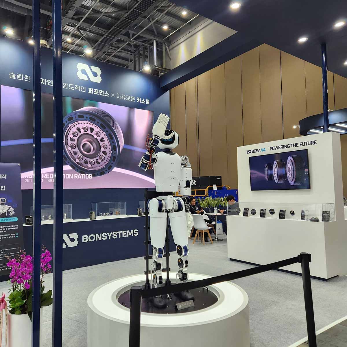 bonsystems's tweet card. A 2025 RoboWorld review from BONSYSTEMS. Explore how we showcased our humanoid robot, cycloidal-based actuators, and development process at the largest Korean robot exhibition.