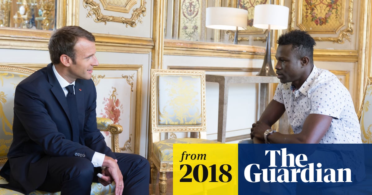 guardian's tweet card. President Macron thanks Malian migrant who climbed four storeys to save boy