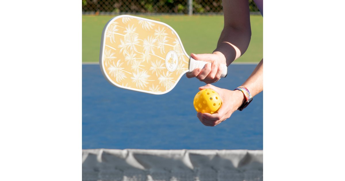ArrayStores's tweet card. Bring tropical vibes to your home with this classic Hawaiian-inspired pickleball paddle design. Featuring lush white palm trees silhouetted against a summery background in shades of golden yellow,...