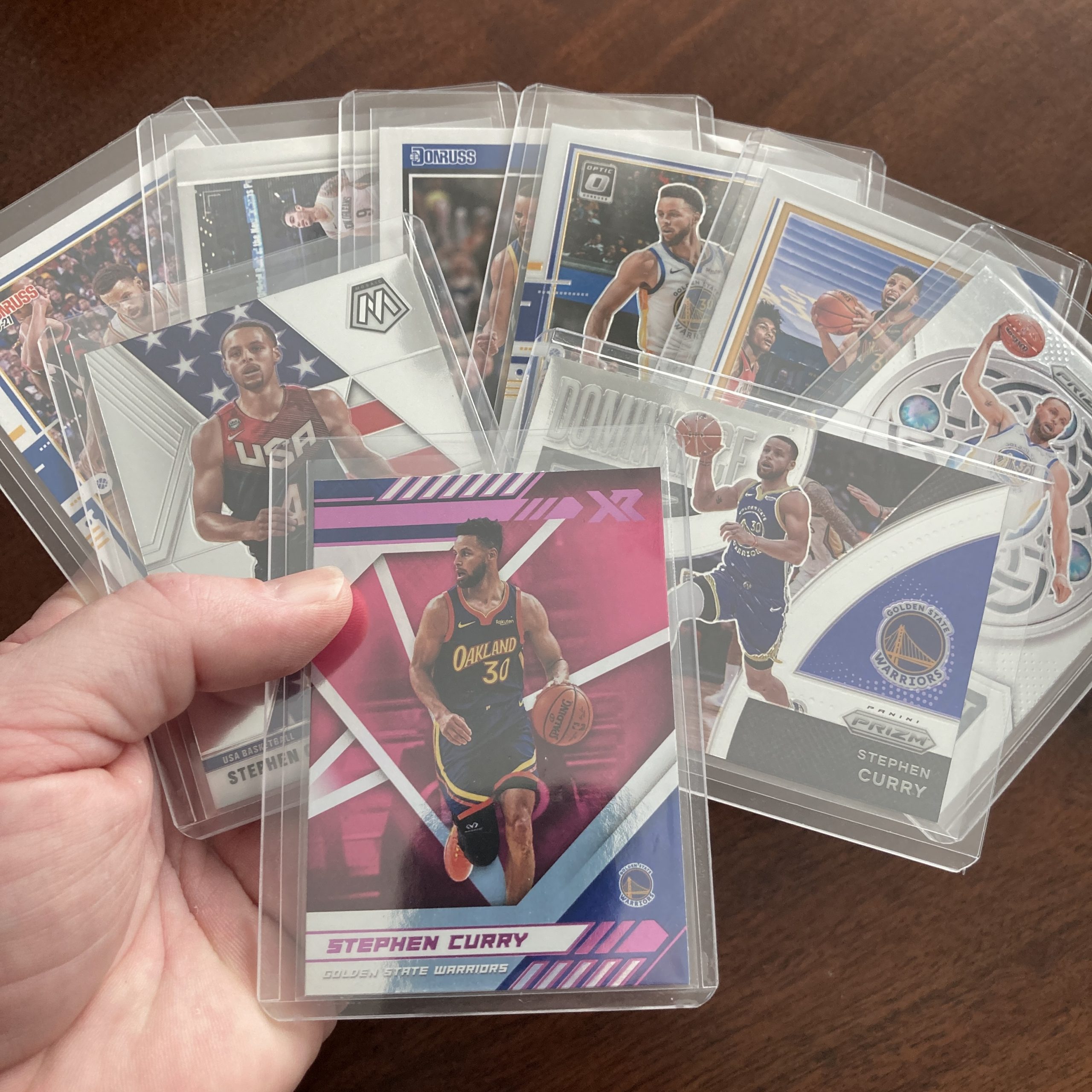 SlamSportsCards's tweet card. Curated pack of nine different Stephen Curry basketball cards including a Panini Chronicles Xr SP Pink holofoil parallel card with other base and insert cards. Nice instant collection bundle of car…