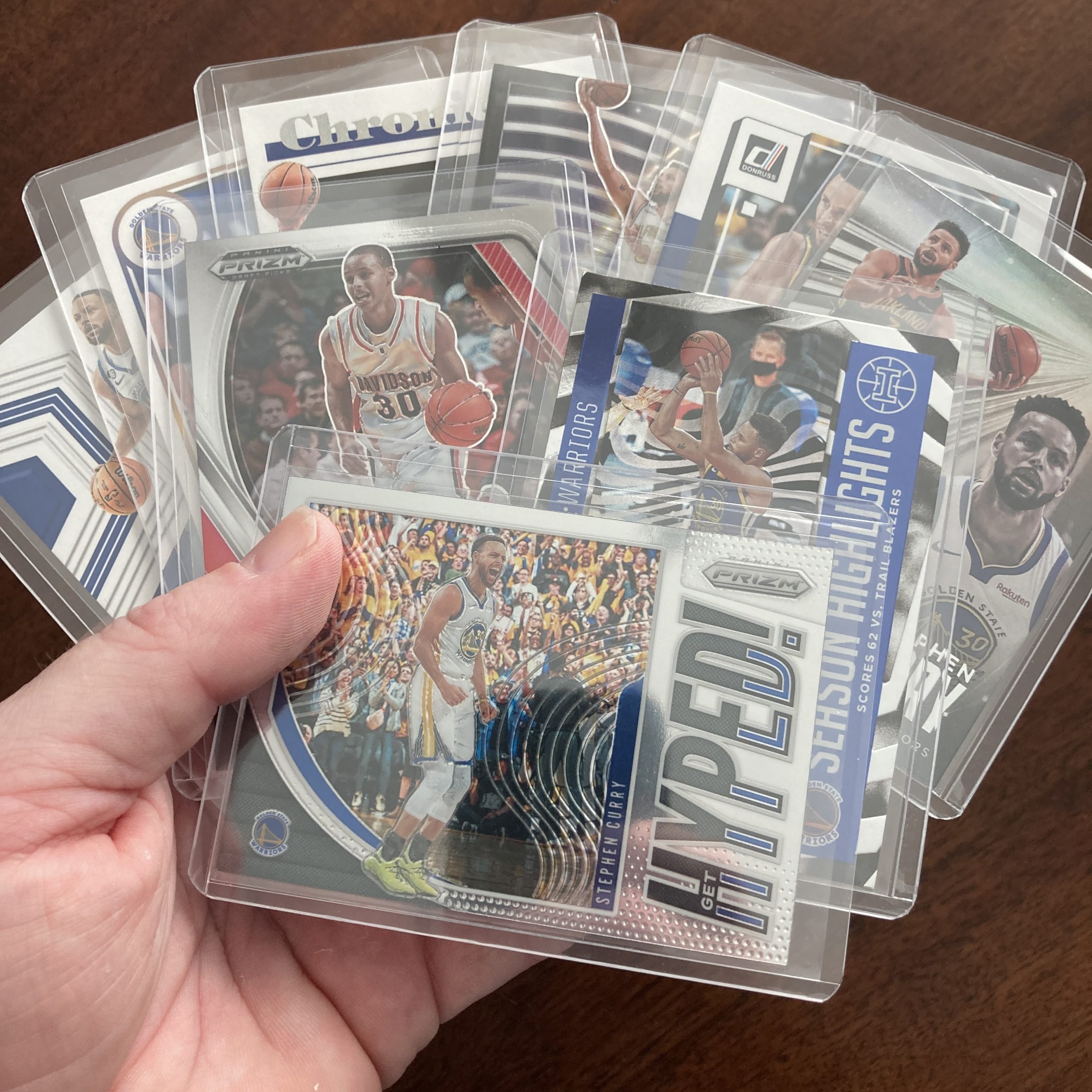 SlamSportsCards's tweet card. Curated pack of nine different Stephen Curry basketball cards including a Panini Illusions holofoil insert card with other base and insert cards. Nice instant collection bundle of cards for a baske…