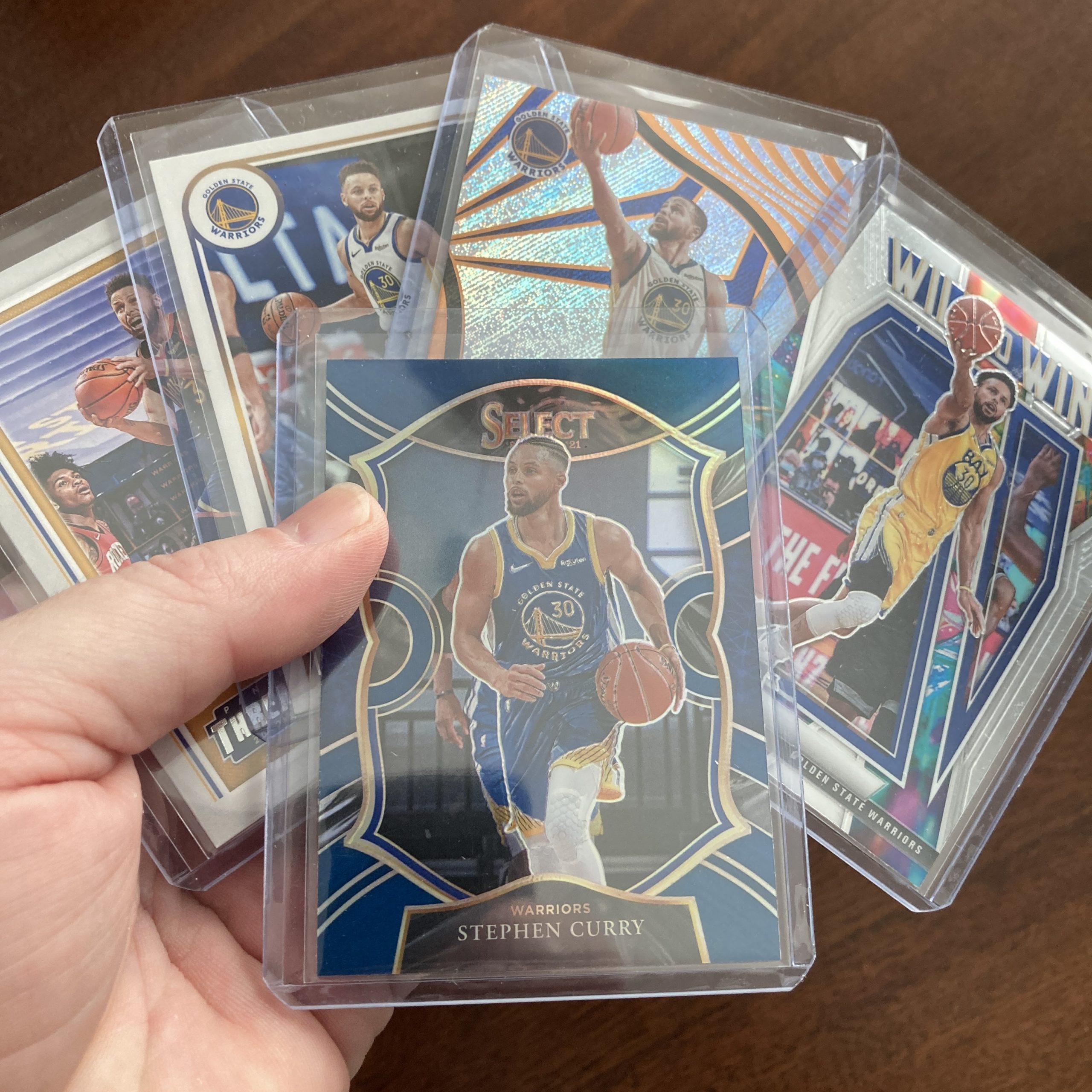 SlamSportsCards's tweet card. Curated pack of five different Stephen Curry basketball cards including a Panini Select SP Blue Prizm holo parallel card with other base and insert cards. Nice instant collection bundle of cards fo…