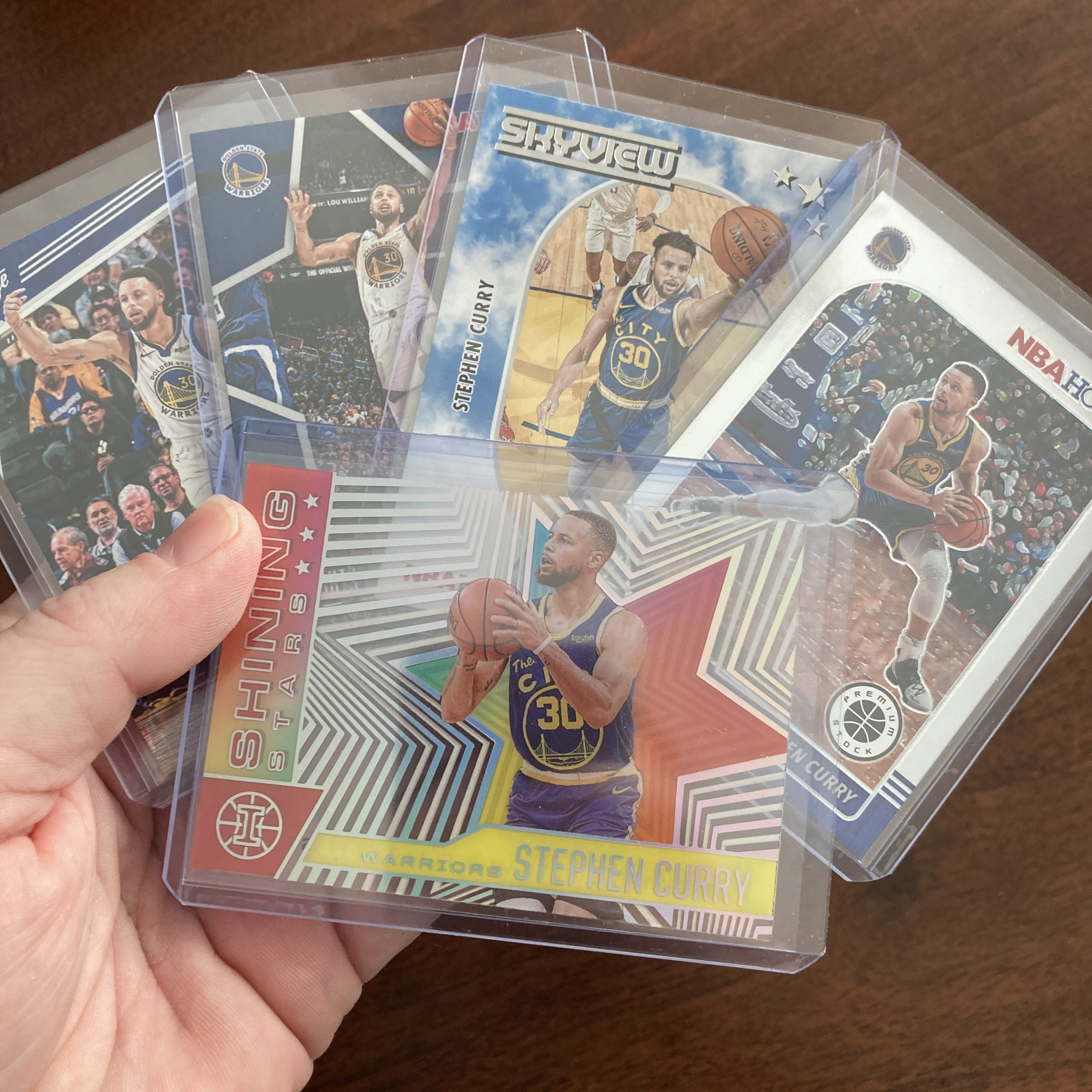 SlamSportsCards's tweet card. Curated pack of five different Stephen Curry basketball cards including a Panini Illusions SP Asia Red and Yellow parallel acetate insert card with other base and insert cards. Nice instant collect…