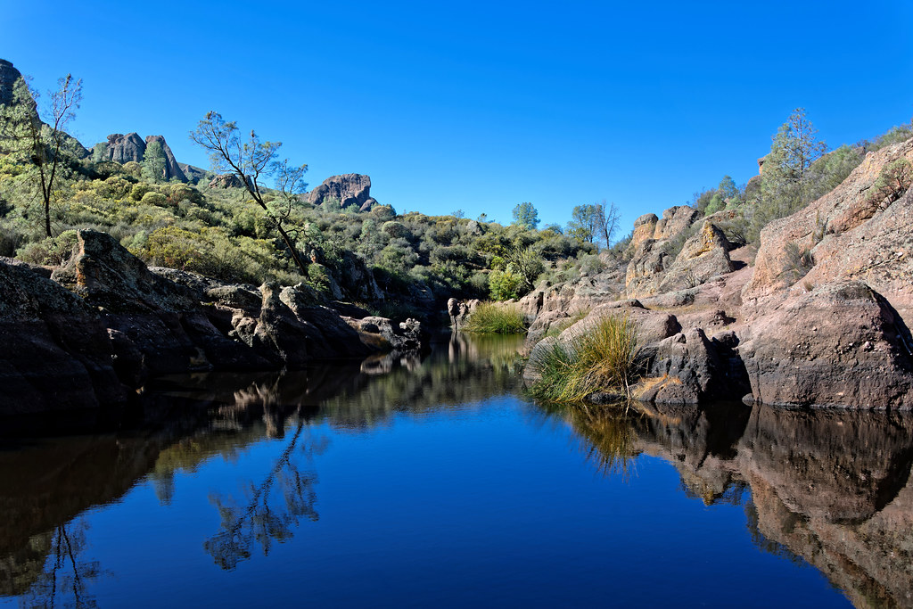 thorsenmark's tweet card. A setting looking to the southwest while taking in views across still, reflective waters of Bear Gulch Reservoir. This was while walking the Moses Spring Trail in Pinnacles National Park. My thought...