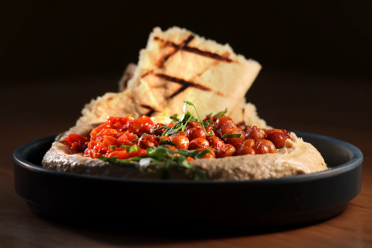 BostonGlobe's tweet card. Here’s what you’ll find at the new Sofra in Allston, which is about twice the size of the original.