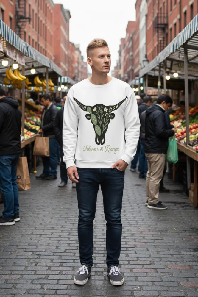 designdelight25's tweet card. Embrace the frontier spirit with botanical flair in our 'Bloom & Range' sweatshirt. Showcasing a floral longhorn skull design, this all-over print is made from 96% GRS-certified recycled polyester...