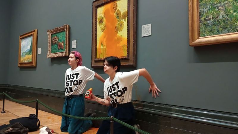 CNN's tweet card. Two anti-fossil fuel protesters who were filmed throwing tomato soup on Van Gogh’s “Sunflowers” in a London gallery Friday have been charged with criminal damage offenses.