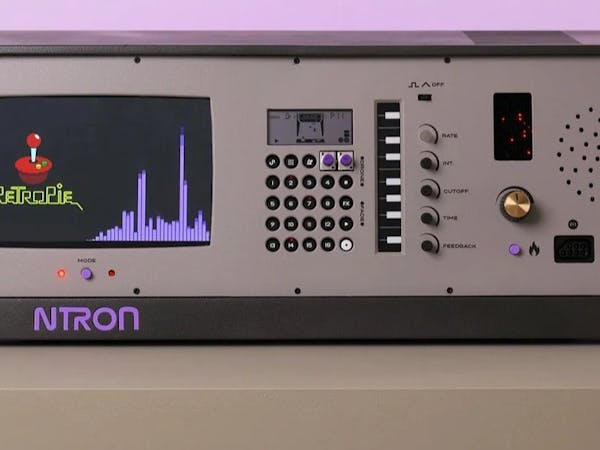 Hacksterio's tweet card. The Raspberry Pi-powered Ntron mashes retro gaming with 8-bit music creation, is NES-controller ready, and will look great in your home.