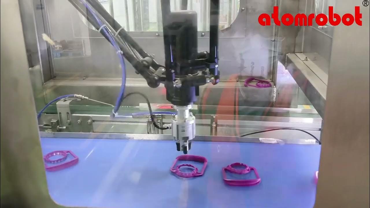 AtomRobots's tweet card. Automatically Sort and Install Plastic Handles onto Buckets