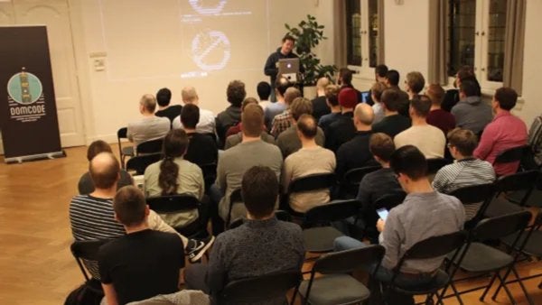 DomCode's tweet card. Are you tired of writing documentation no one ever reads? Or going through endless test files that you don't seem to comprehend? Look no further, cause tonight [Karl van He