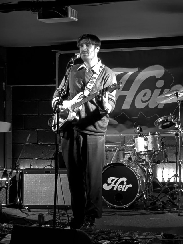 secondwaveblog's tweet card. On a cold, wet Friday, Heir hustle into YES Basement in Manchester for a pitstop on their current Spring tour. First up is CJ Pandit, who performs a charismatic…