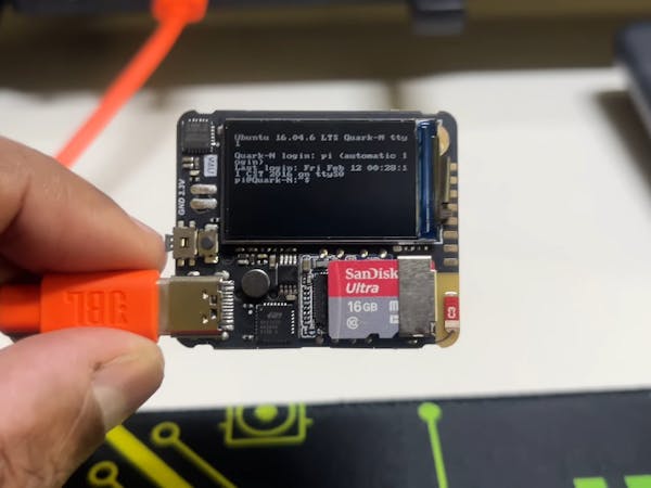 Hacksterio's tweet card. The Quantum Mini is barely bigger than a postage stamp, but it packs a quad-core CPU, GPU, Wi-Fi, sensors, and it can run Linux.