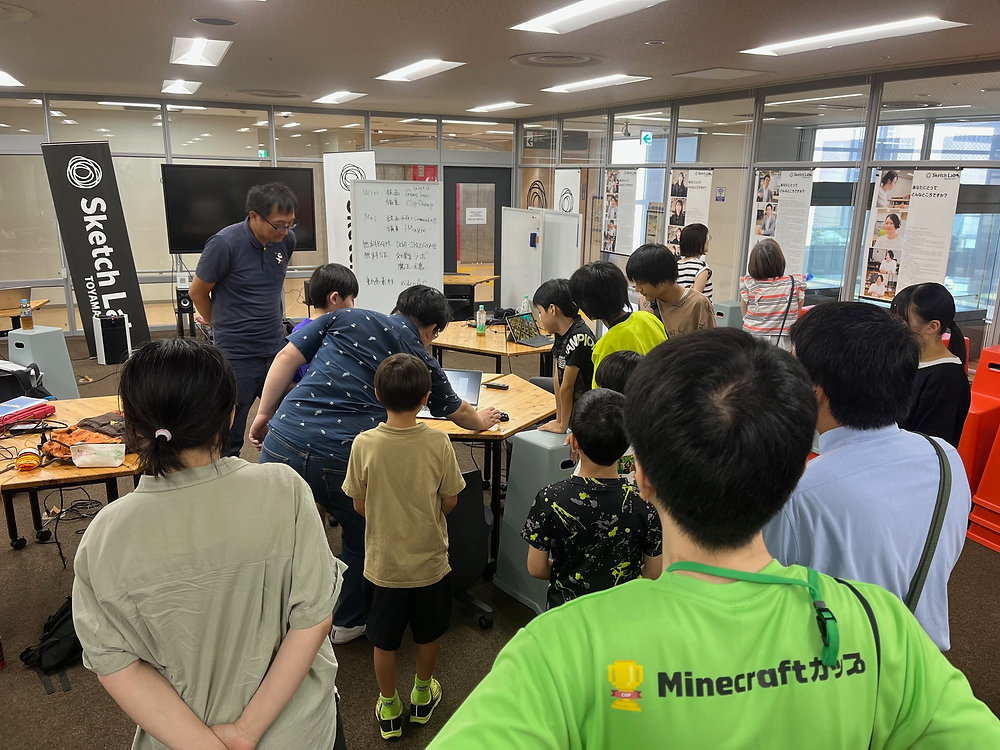CoderDojoToyama's tweet card. まとめての開催報告です！（生きてます！笑）今年も６月から富山では、スケッチラボさんや富山市さんなどの協力をいただき、Road to マインクラフト in 富山として、マイクラカップへ挑戦する子たちの応援をするイベントを４回に分けて開催しています。普段のCoderDojoもマイクラカップに向けた活動の場として使ってもらっています。４回目は審査会として、動画とプレゼンでの発表と審査をします！これ...