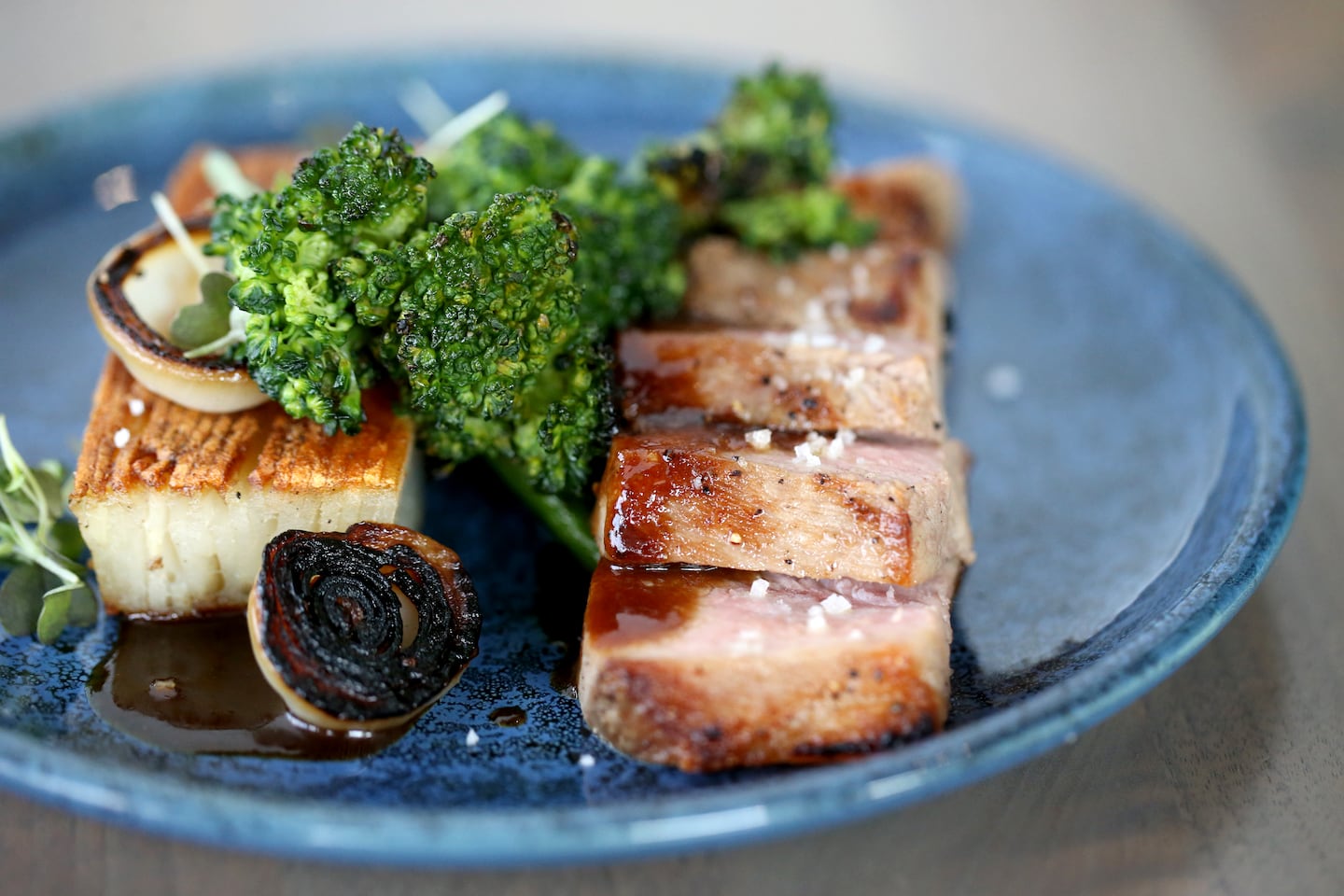 BostonGlobe's tweet card. Stylish and substantive, the Seaport restaurant is worth visiting on its own merits.