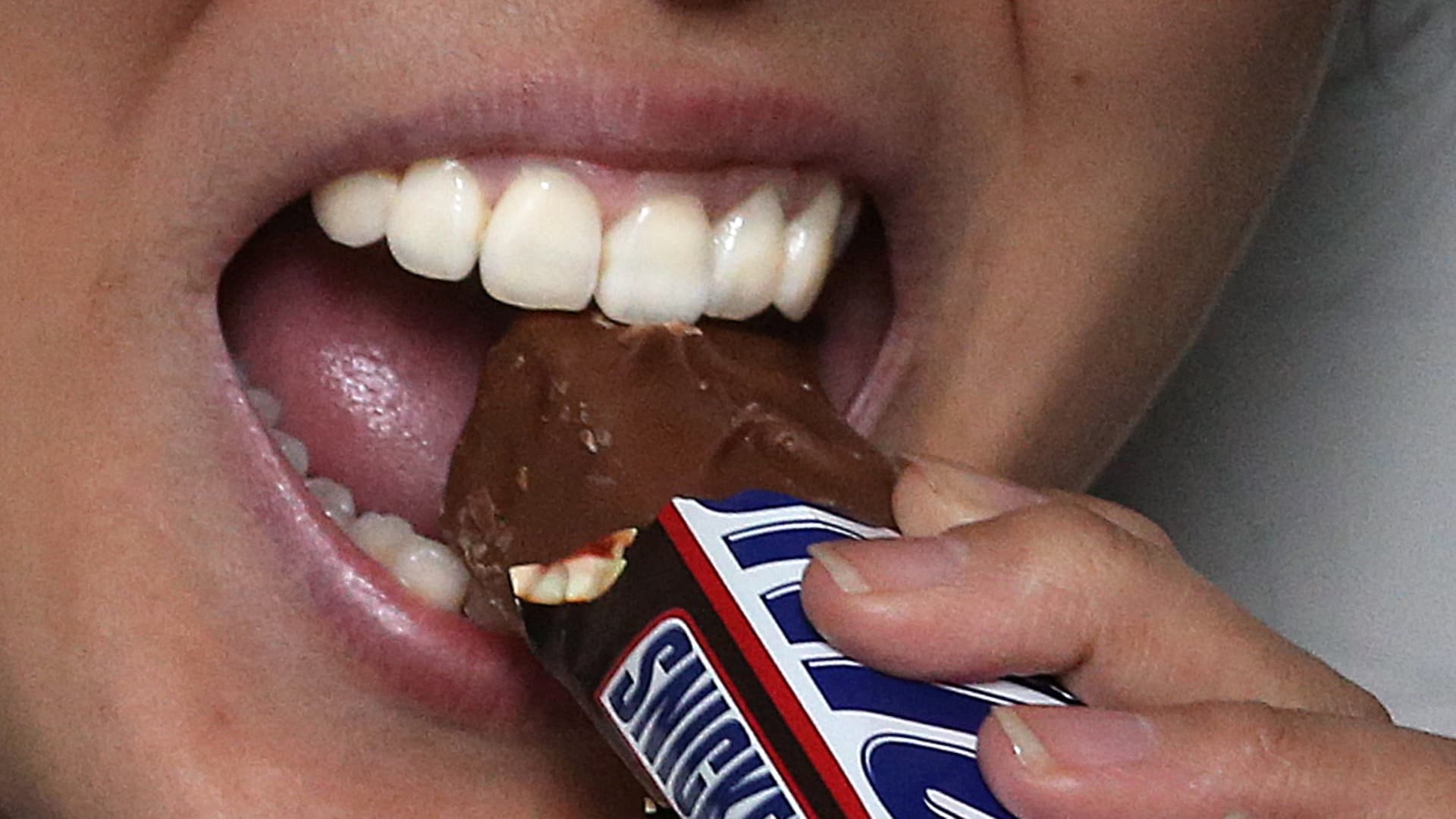 ReactMedia's tweet card. Snickers and 7-Eleven have teamed up to bring discounted candy to customers in Australia based on a "Hungerithm" that monitors mood on Twitter.