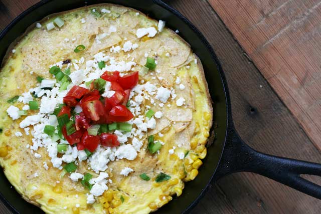 CheapRecipeBlog's tweet card. Try something new for breakfast! Traditional Mexican chilaquiles, consisting of fried corn tortillas or tortilla chips, combined with eggs, cheese, corn,