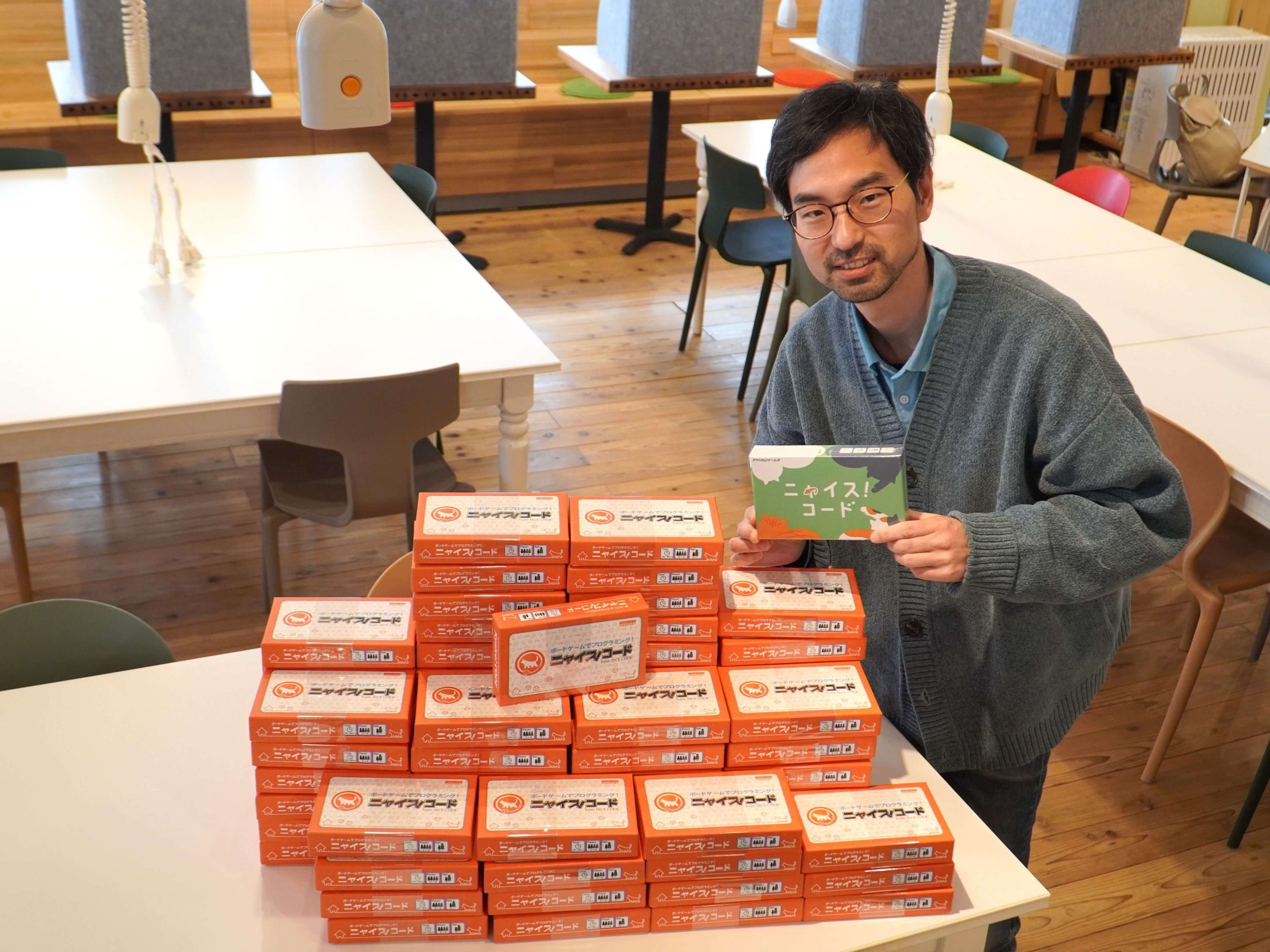 CoderDojoOwari's tweet card. ボードゲーム開発などを手掛けるRPGworksより、CoderDojo 向けにダイス×プログラミング『ニャイス！コード』を７５台寄贈