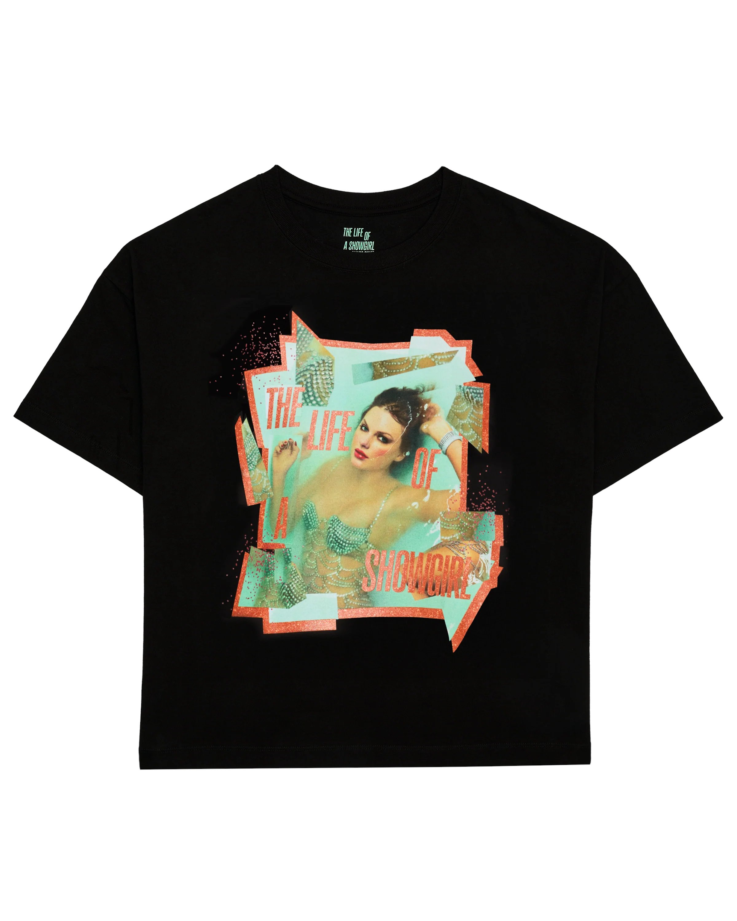 swiftpitch_py's tweet card. Black t-shirt featuring "The Life of a Showgirl" album logo in orange sparkle and photo of Taylor Swift with orange sparkle border printed on front and "The Life of A Showgirl" album logo, "Taylor...