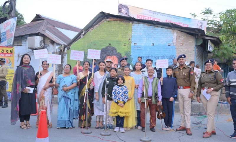NENowNews's tweet card. Bajali Police conduct road safety awareness programme in Pathsala, engaging public with leaflets, advice, and live Zubeen Garg performances.