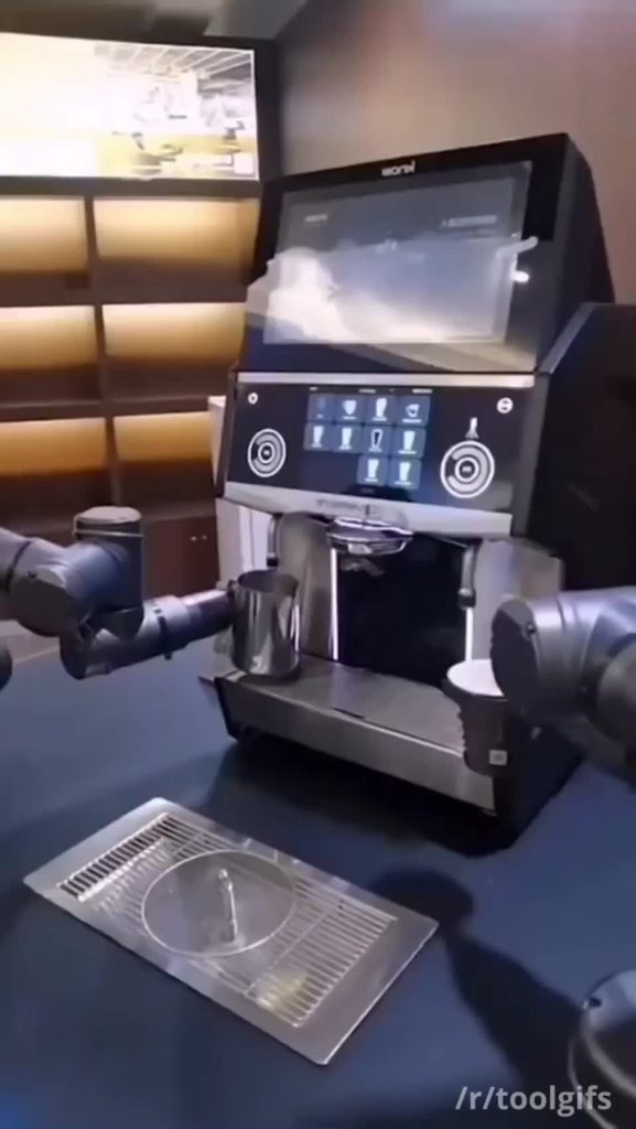 ComputingSGS's tweet card. Robot barista pouring latte art