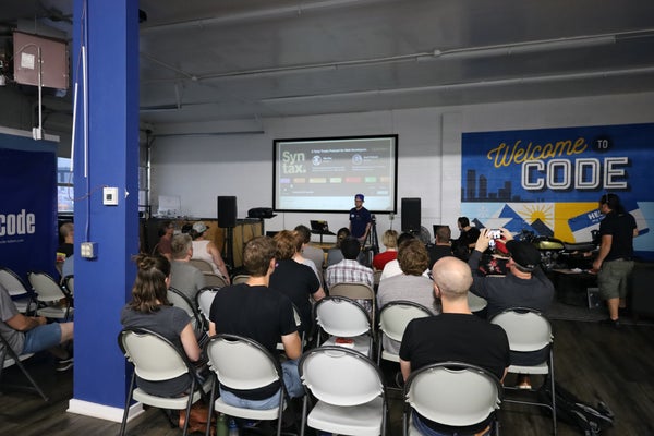 DenverScript's tweet card. This month Donnie Flood will be giving the talk "Hotdogjs - Real-time, multi-player LiveView web framework at the speed of Bun" and CJ Reynolds will be giving the talk "Hon