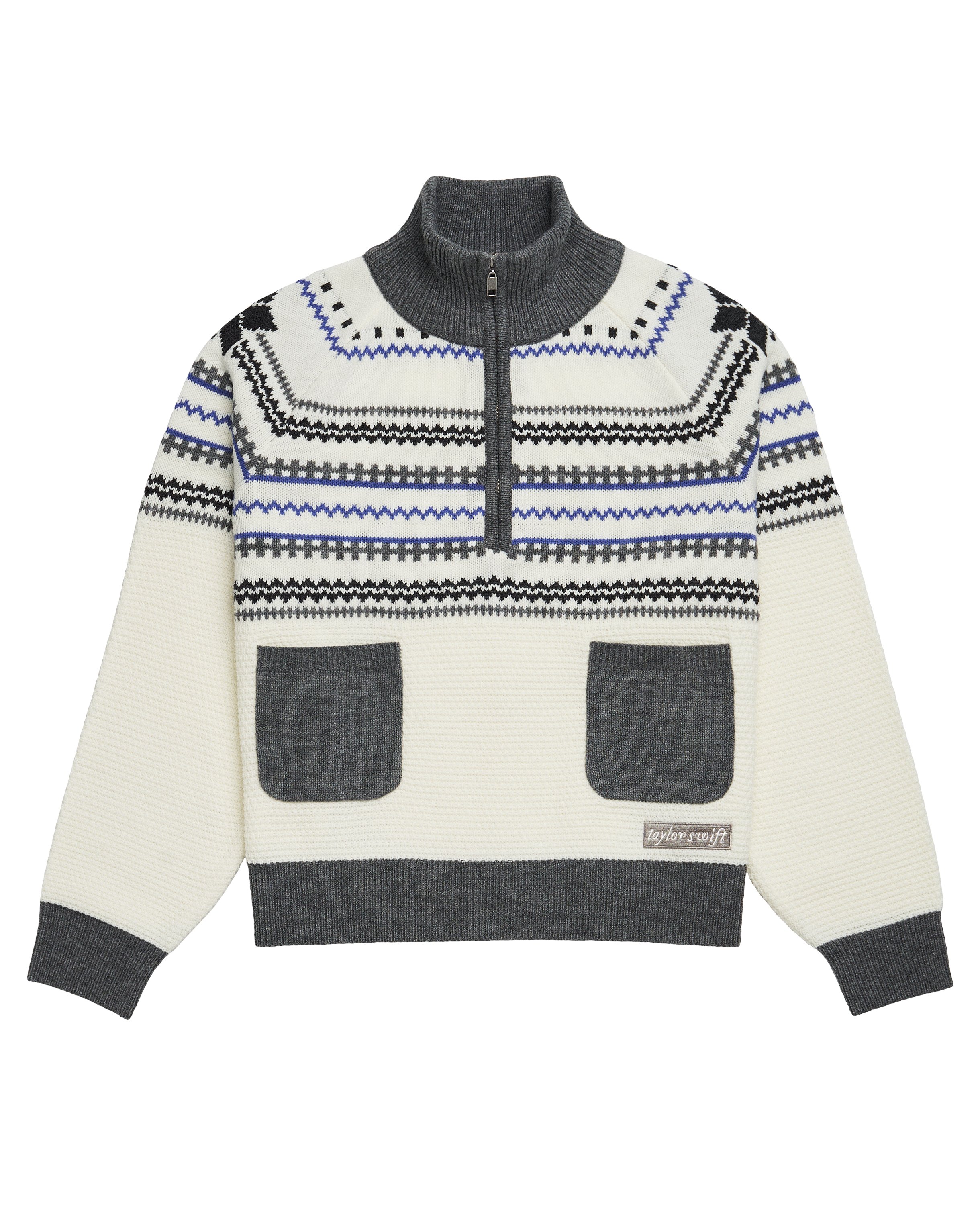 swiftpitch_py's tweet card. White, violet and gray fair isle knit quarter zip up sweater featuring two front patch pockets, "TS" logo zipper pull, and "taylor swift" logo patch embroidered on wearer's left hem.Standard unisex...