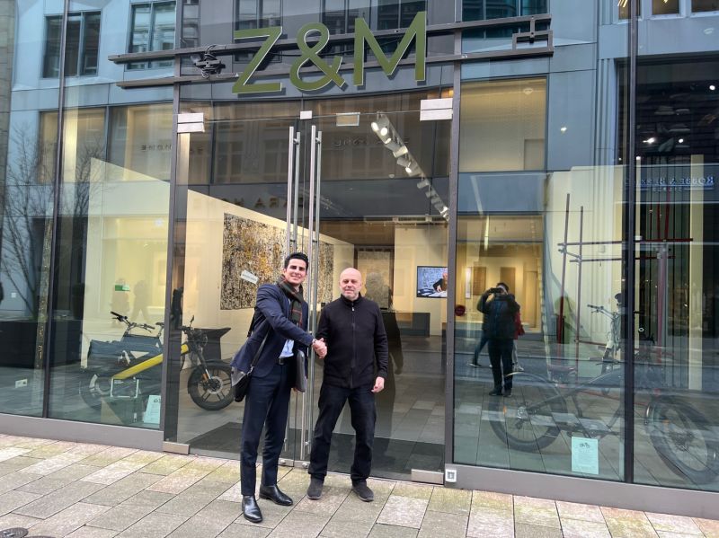 AlgorithmX8's tweet card. Long story short, it’s all about right people coming together. Dear Mr. Leins, I am proud to support you and shape a part of the future with you. This building was the first Tesla Store in Europe...