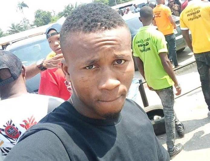 fisayosoyombo's tweet card. "We set a date, enlarged one of his photographs, bought flowers, and arranged them around the picture. A Reverend Father offered prayers."