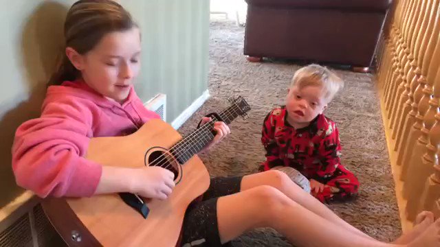 A mom captured this beautiful moment when she saw her daughter singing to her baby brother.
She uses singing as a method of speech therapy so her little brother w/down syndrome can learn to speak and it is working.