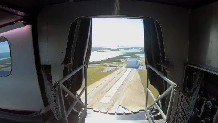View of Launch Complex 39A and Crew Dragon from the crew access arm