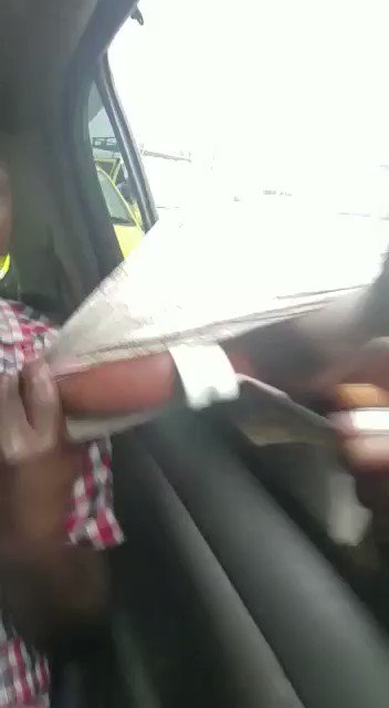 This guy attempted to pull a phone from this car and the passengers caught his hand and this is what happened 🤣 🤣 🤣 🤣 🤣 🤣 🤣 🤣 🤣 🤣