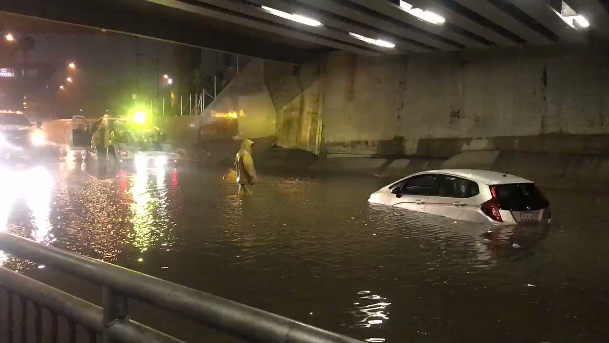 Tow truck driver is working to pull this car out of flooded underpass near Douglas and Katella in Anaheim. Luckily, the driver was able to get out safely. She says the water was only up to her tires when she tried to drive through. @CBSLA