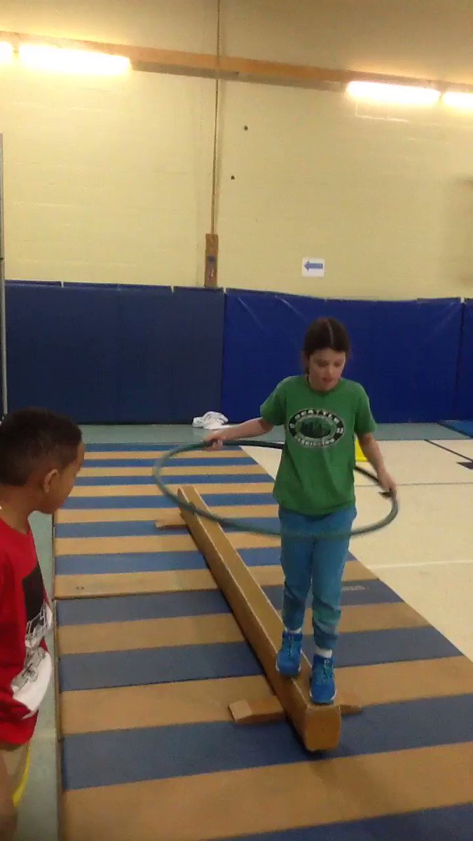 Balance beam skills during 3rd grade gymnastics station.