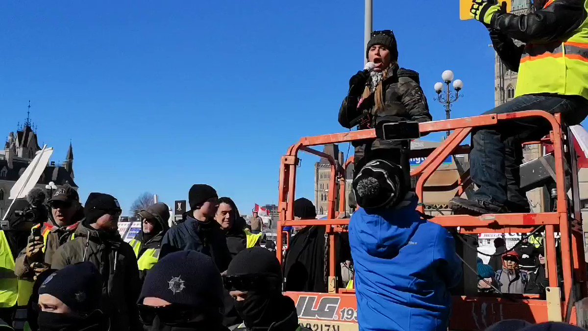 Faith Goldy tried to speak at #unitedweroll protest but was drowned out by Indigenous rights and Antifa activists, who yelled, "Nazi scum off our streets!" Convoy supporters chanted "Commie scum off our streets!"