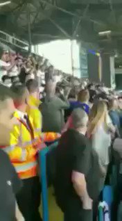 A Leeds united fan having a casual crowd surf during the game...