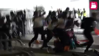 Some policemen surrounded one of the female protesters who shrink at floor and hit her with their shields and batons. repost from HKappledailyPlease RT!! #HONGKONG #ExtraditionLaw #Extraditionbill #NoChinaExtradition #NoExtraditiontoChina #香港 #逃亡犯条例