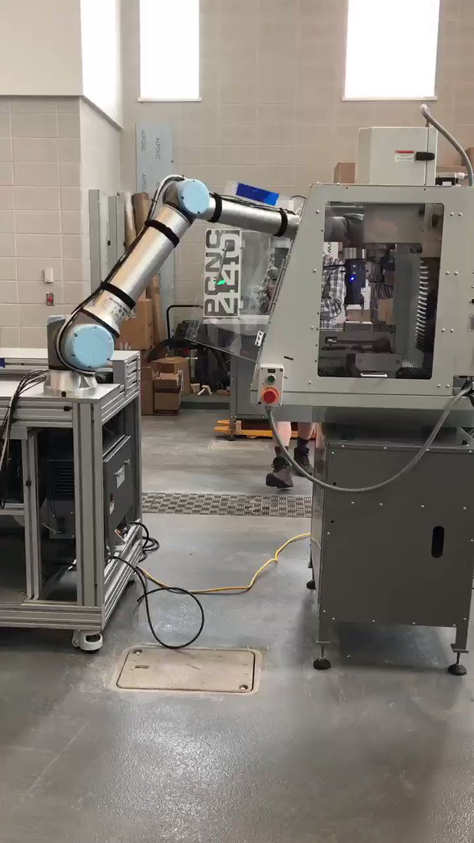 Mechanical Engineering Technology student Connor MacInnis and his robot present Peter Moore with a special gift at the signage unveiling of the Peter B. Moore Advanced Technology Centre. #robots #innovation @Moore_Packaging