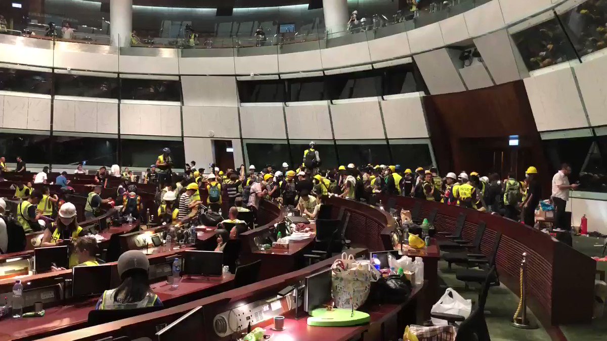 11:30 pm, protesters still occupying the main legislative chamber inside the Legislative Council building of Hong Kong. Some argue to stay, others argue to leave. The fact that I’m writing this tweet from inside this room is surreal. #hongkong