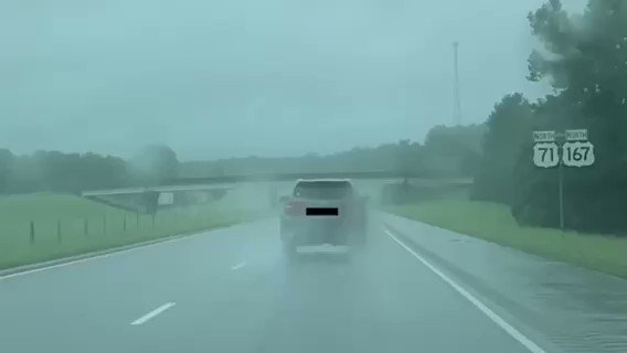 Hazard lights should only be used if a vehicle is disabled in the roadway or on the shoulder. There is no need to use your flashers while driving in the rain. It is actually against #Louisiana law. (video taken by a passenger)#TropicalStormBarry #Barry