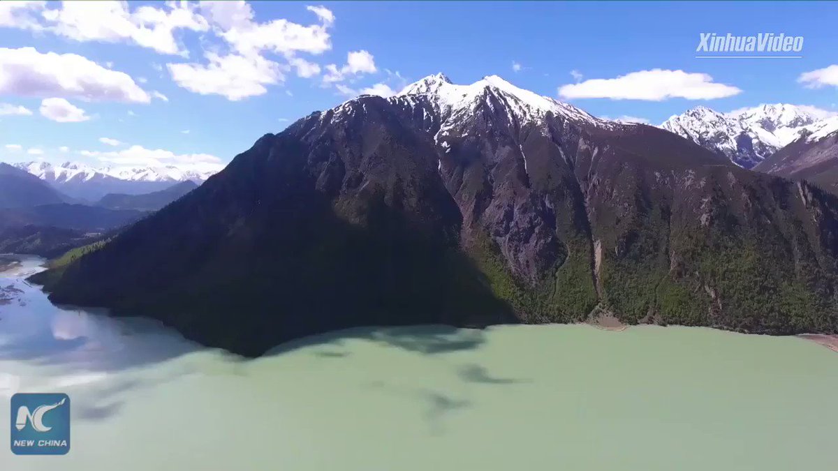 With an altitude of 3,850 meters, Ranwu Lake in China's Tibet is surrounded by snow-capped peaks and green forests in summer. #FlyOverChina