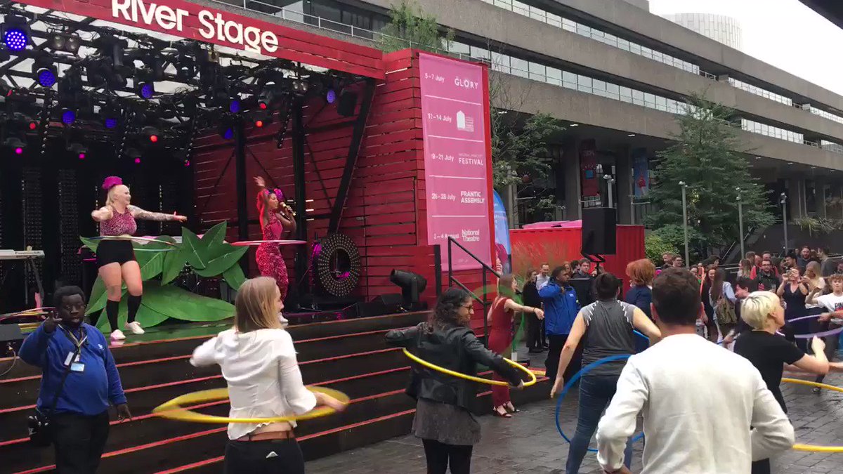 Mass hula-hooping on the @NationalTheatre River Stage to kick start the #London #NationalParkCityFestival.#NationalParkCity hula-hooping in all weathers!!!